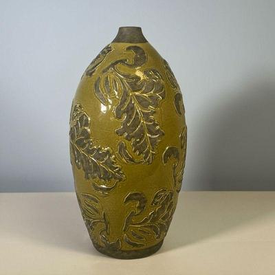 OVOID POTTERY VASE | Green glazed pottery vase with leafy design in relief, of ovoid shape. - h. 15-1/2 x dia. 8 in