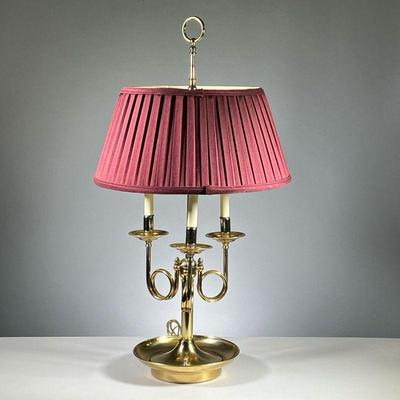 BOULLOITE LAMP | Brass bouillotte table lamp, 20th century, with nice details and regular bulb fittings, red plated shade. - w. 30 x h....
