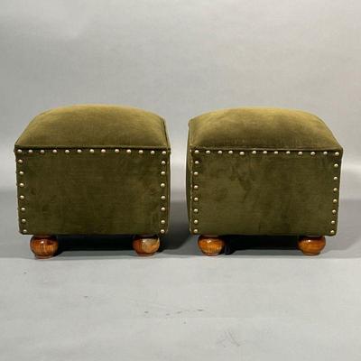 PAIR VELVET FOOTSTOOLS | Green velvet upholstered foot rests with cushion tops, on wood bun feet, with brass tacks. - l. 14 x w. 14 x h....