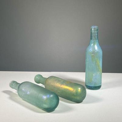 (3PC) IRIDESCENT GLASS BOTTLES | Art glass iridescent bottles, two with rounded bottoms. - h. 9.25 in