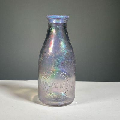 TELFER BROS MILK BOTTLE | Iridescent art glass bottle, Oakland Dairy / Bay Shore NY. h. 9 in