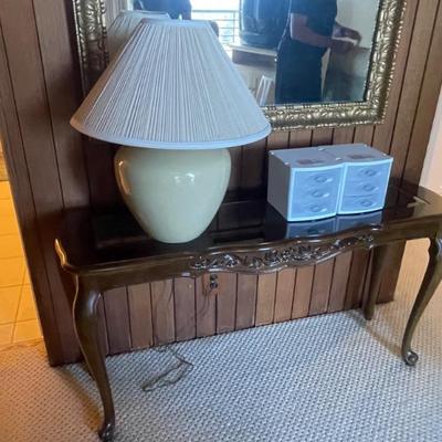 lamp, plastic file, and console table.