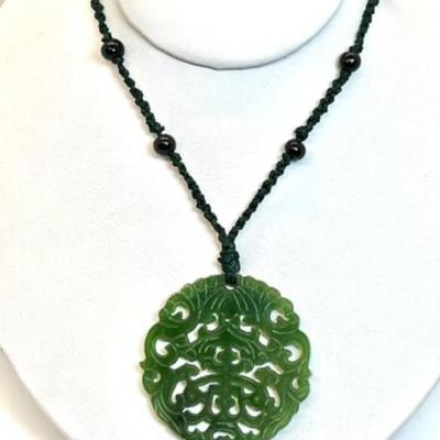 #82 â€¢ Gorgeous Carved Jade Pendant on Woven Cord

