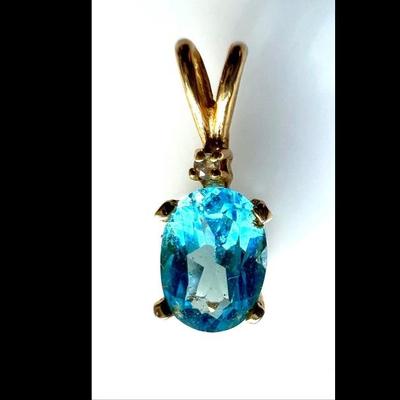 #120 â€¢ Small Faceted Oval Blue Topaz and Diamond Chip Pendant in 14K Gold
