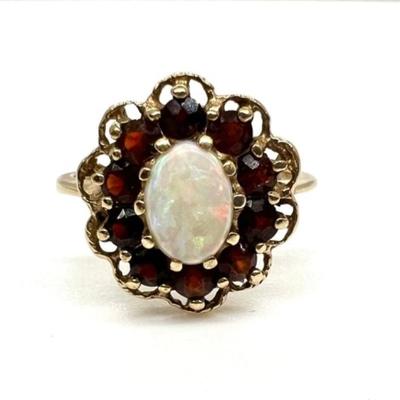 #93 â€¢ Vintage 10 K Gold Ring With Oval Opal And Halo of Ten Garnet Stones - Size 6.75
