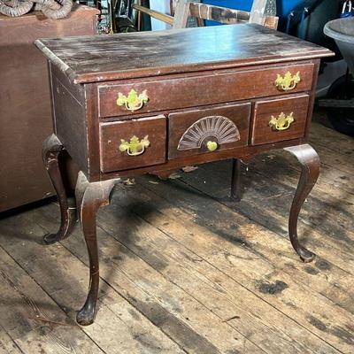 QUEEN ANNE STYLE LOWBOY | Mahogany Queen Anne style lowboy; a low cutlery storage drawer above three small drawers; fan carving;...