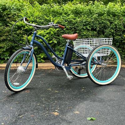 EVRY JOURNEY ELECTRIC TRICYCLE | SixThreeZero Evry Journey 250W Electric Tricycle in metallic blue with light blue wheel rims. Tricycle...