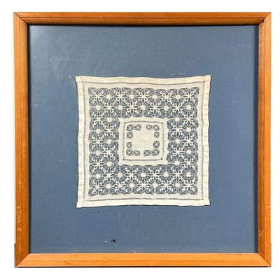 FRAMED DOILY | Doily on blue matt framed behind glass. - l. 15.5 x w. 16 in (overall)
