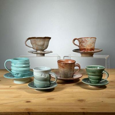 (6PC) ART POTTERY CUPS & SAUCERS | Including brown and green glazed tea cups each with a matching saucer. - h. 3.25 x dia. 4 in (largest...