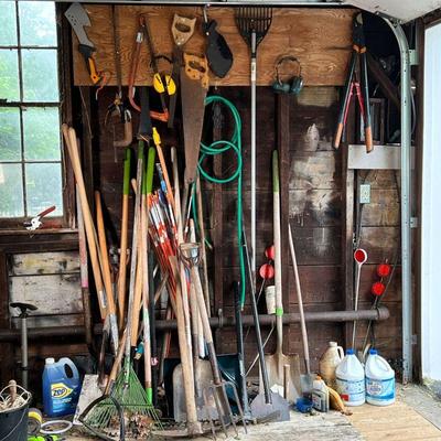 LARGE LOT OF YARD TOOLS | Lot of assorted yard tools (rakes, shovels, saws, hoes)

