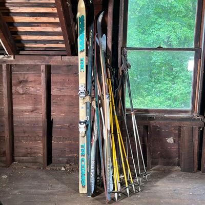 LARGE LOT VINTAGE SKIS AND POLES | Various vintage skis and poles by TRC, Salomon, LL Bean, and Elite. - l. 73 in (TRC)
