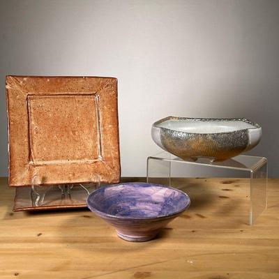 (4PC) MEG SMEAL POTTERY GROUP | By Meg Smeal and other Potters Including a pair of square round glazed plates a textured bowl and a...