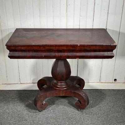EMPIRE GAMES TABLE | 19th C Empire Games Table with pedestal base.  Some veneer loss. - l. 36 x w. 18 x h. 29 in (Closed)