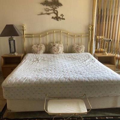 Another king size bed with brass headboard