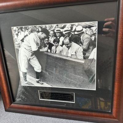 Photo of Gabby Hartnett of the Chicago Cubs Autographing a baseball for Al Capones son just before the game. NOTE the watchfulness of...