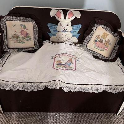 Child's bunny storage chest with embroidered pillows and cover