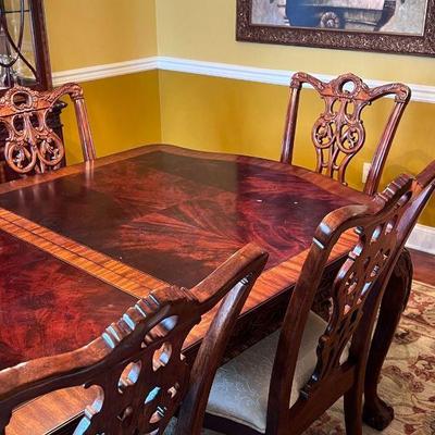 Mahogany dining table with Chippendale style chairs (includes 2 leafs) 