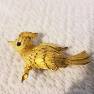 Textured gold-tone bird on a branch pin/brooch