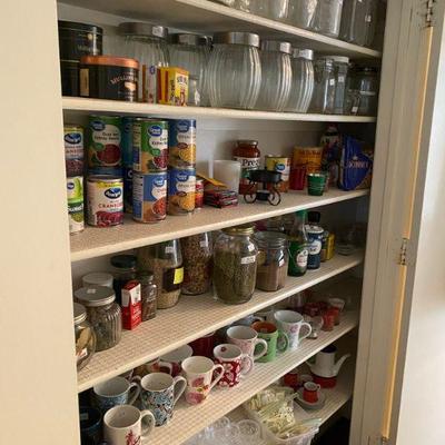 Pantry full of Canned Goods, Coffee Mugs and Candles