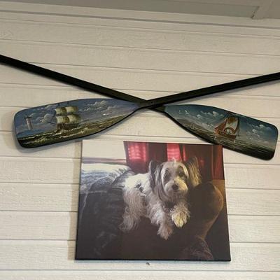 painted wooden paddles and dog picture