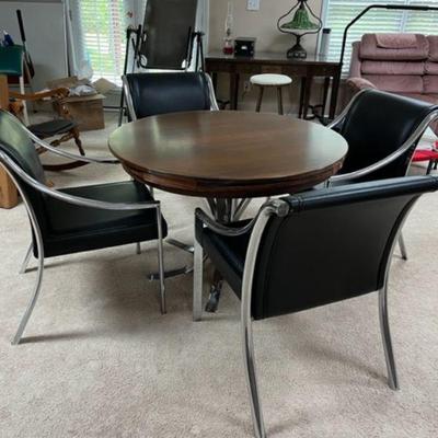 4 black leather and chrome chairs with 42