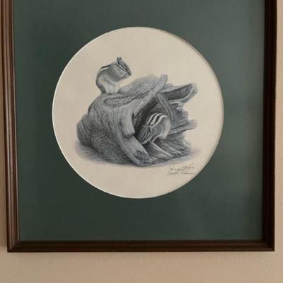 Framed artist's drawing of  chipmunks on a stump
