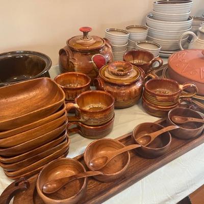 Glazed pottery and various teak bowls and platters. 