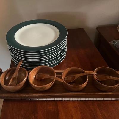 Carved serving bowls with wooden spoons and tray.