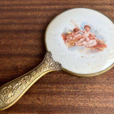 Victorian Cherub Motif Painted Porcelain Backed Hand Mirror With Repousse Brass HandleÂ 