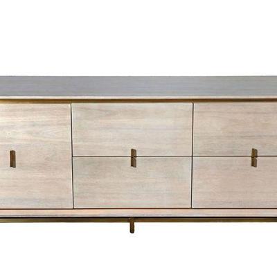 Lara MCM CB2 Low Dresser  is bleached oak with veneer with modern brass pulls and modern brass legs.Â $800.00 OBO Retails for $2,200.00...