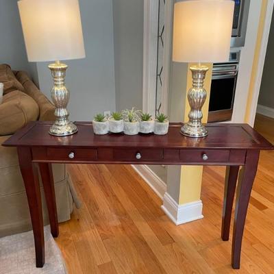 Three drawer console table.