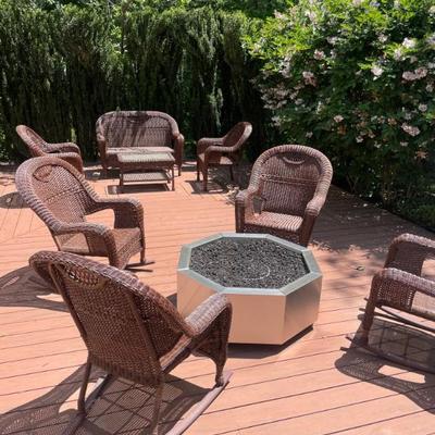 Four wicker rockers, with custom cushions. FIrepit not for sale.
