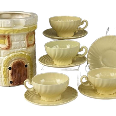 American Bisque Cardinal Castle
Cookie Jar, Franciscan Saucers and Yellow
Tea Cups