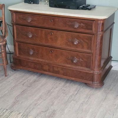 Very old, very nice dresser with four drawers and a marble top