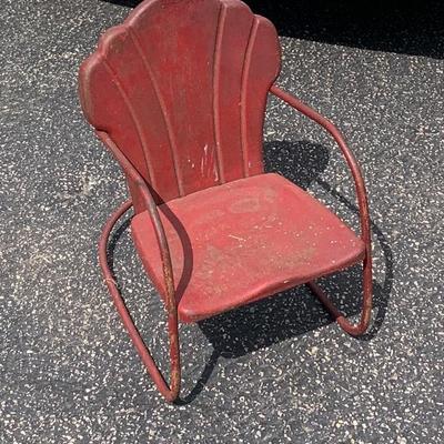 Vtg. childâ€™s outdoor chair in funky red