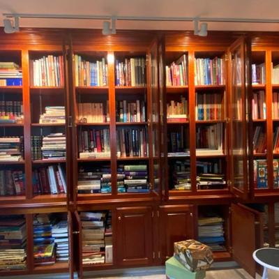 Book case with hundreds of antique reference books