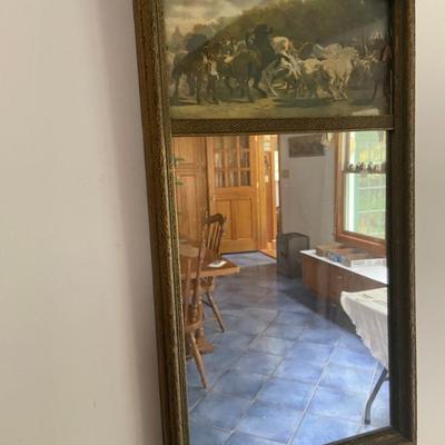 Mirror with horses atop