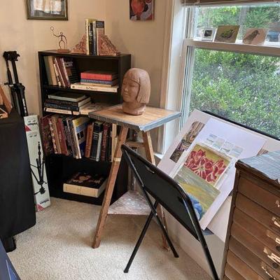 "The Art Room" - chest with many drawers, art books, sculpture stand with rotating top, artwork on paper 