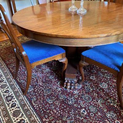 Antique dining table, Ariana rug made in USA