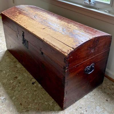 Antique painted humpback trunk, iron metalwork, lined with early 1800s newspaper