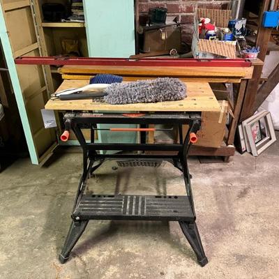 Basement workshop with lots of hand tools, saws and more.