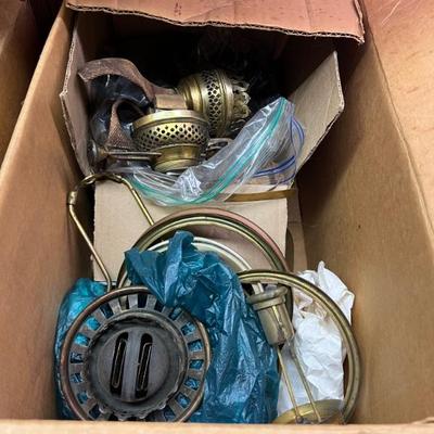 Boxes and boxes of antique lamp parts, shades, beads, and more, throughout all home levels.