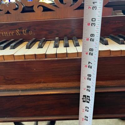 Antique square piano with pump function. Plays well. Exterior could use refinishing.