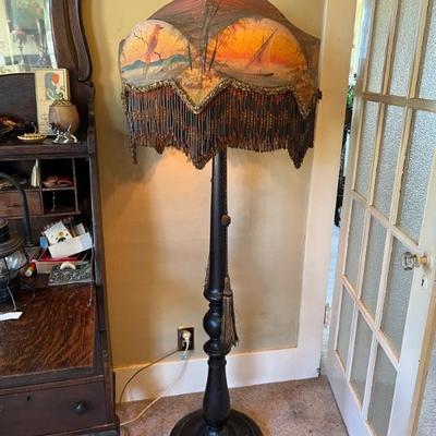 Several large antique standing lamps