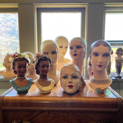 Vintage mannequin heads for display of hats 