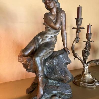 Beautiful sculpture statue of a woman seated on a rock, titled Exilee, and design attributed to Julien Causse 