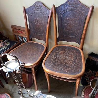 Beautiful antique chairs with pressed embossed leather deaign. 