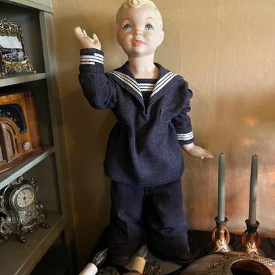 Antique boy mannequin, with blonde hair and blue eyes, used in stores in the 1930â€™s to display popular sailor suits