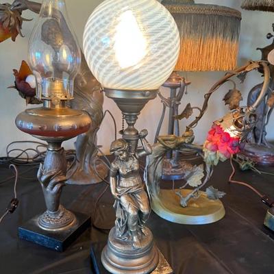 Dozens of antique table lamps from the art deco and art nouveau periods. 