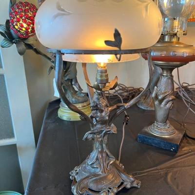 Dozens of antique table lamps from the art deco and art nouveau periods. 